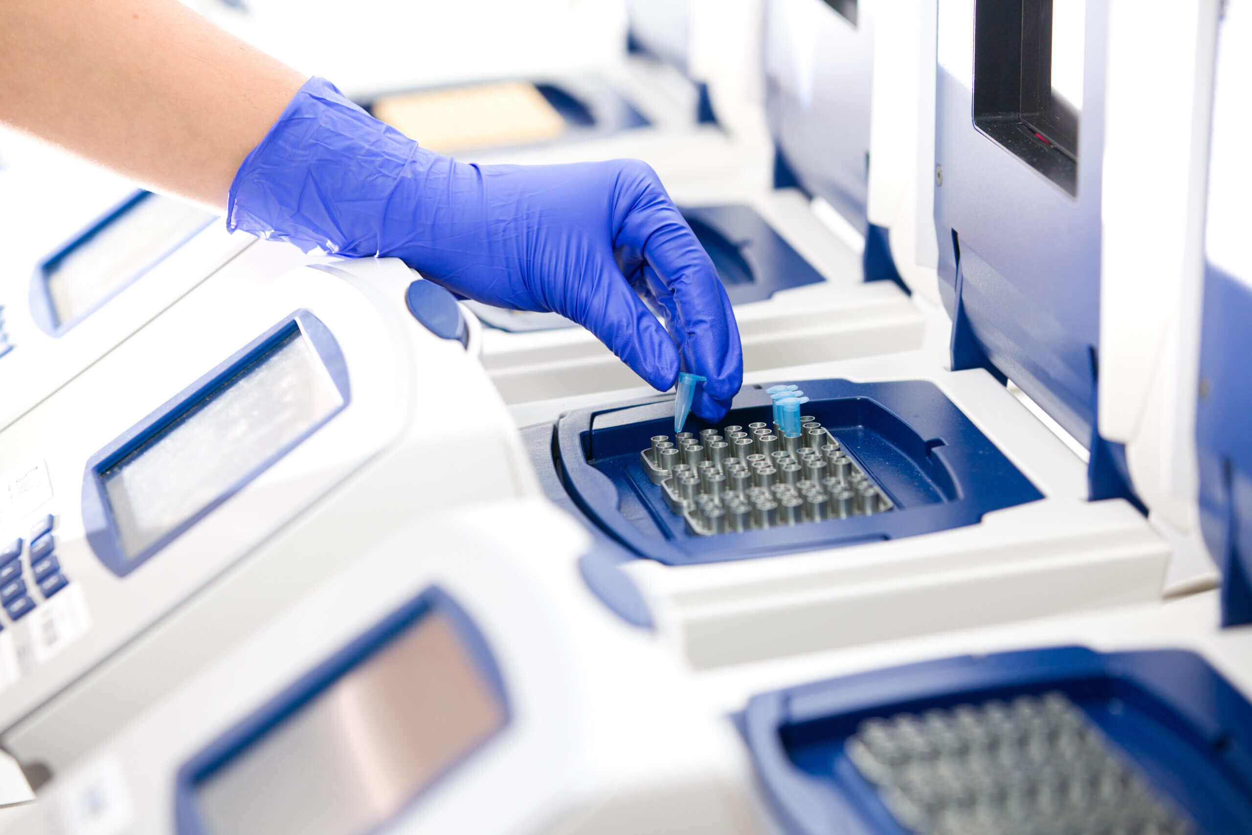 Scientist with DNA copying, Real-time PCR cycler